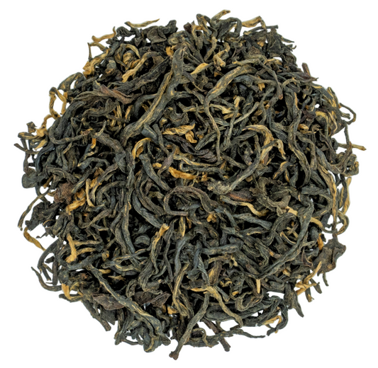 Dried black tea leaves on a white background